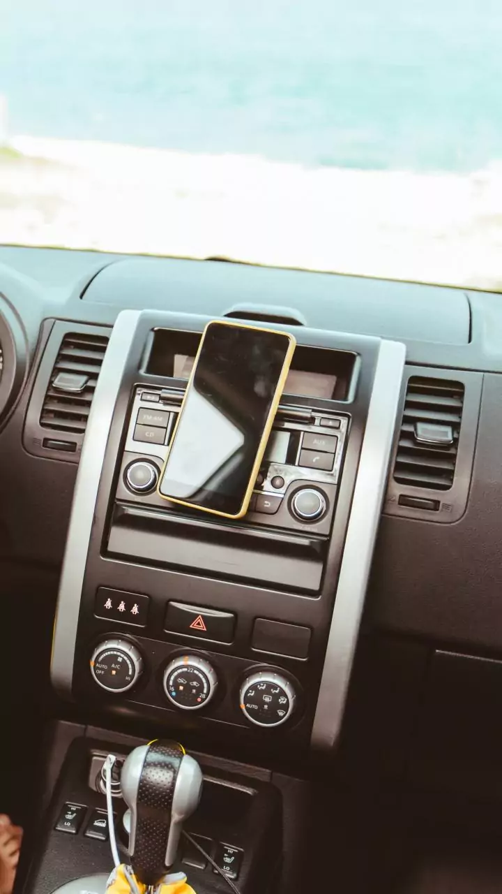 Dashboard heat spikes fast—wrong parking spots can damage your phone quickly