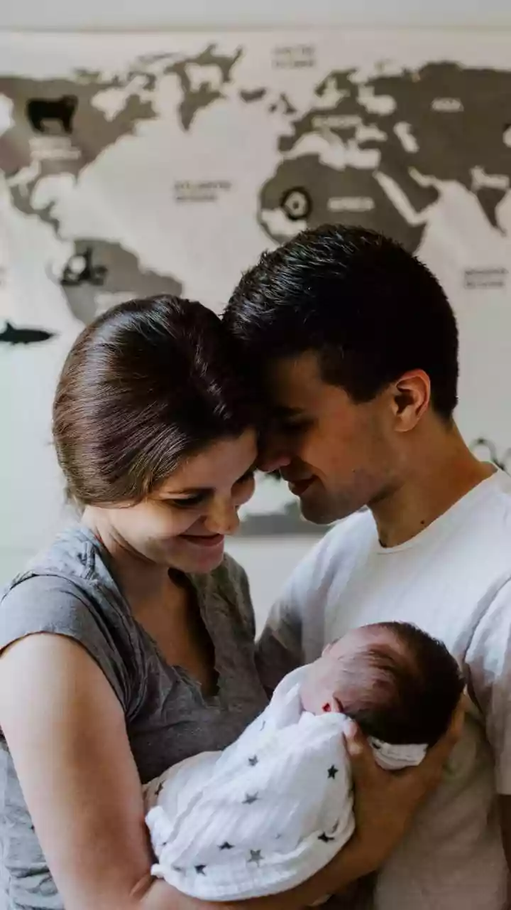 New Father's Trembling Hands: Viral Video Captures First Hold of Newborn