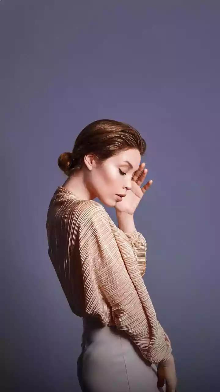 Strong-Hold Hairspray Helps the Low Bun Stay Polished through the Day