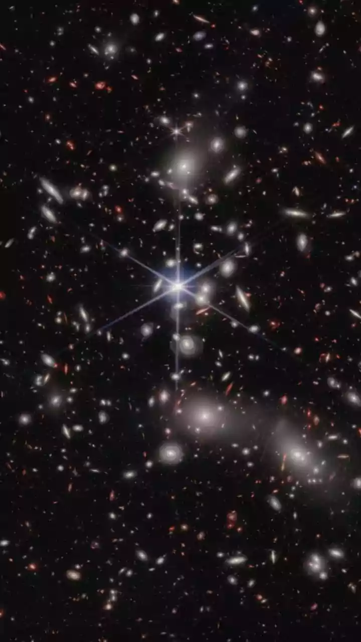 Webb Telescope's Glimpse: Warping Space-Time