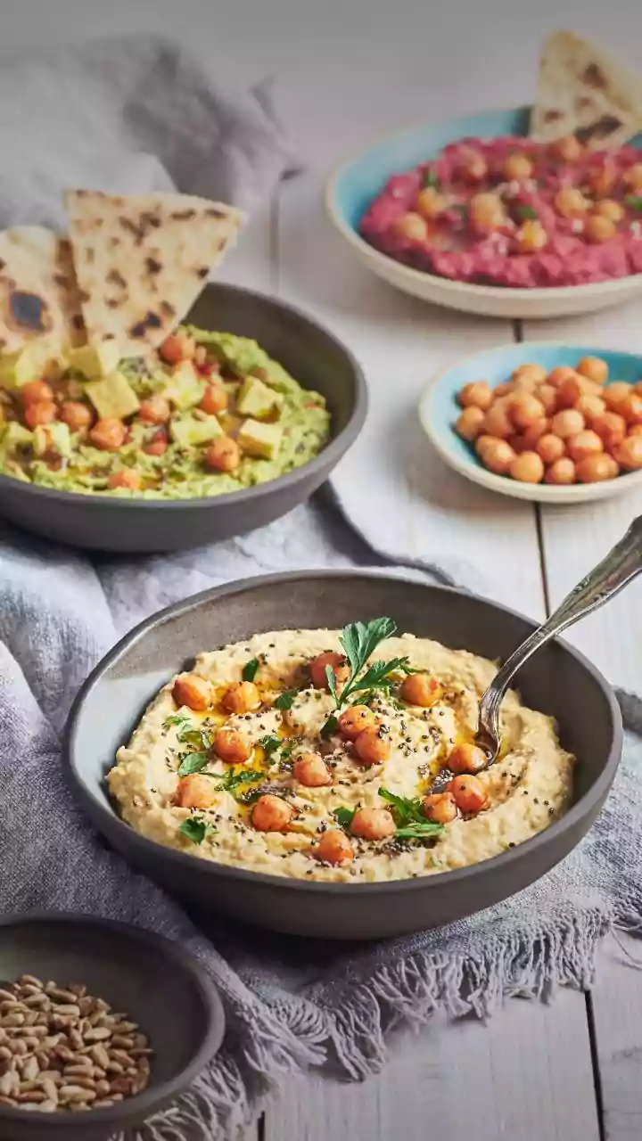How Squeezing Lemon Juice Over Chickpeas Creates Bright Tangy Hummus Snack Dip