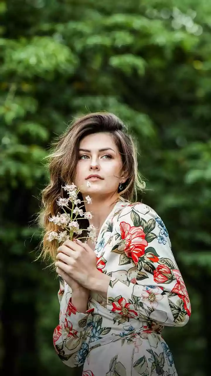 Loose Waves Can Carry Floral Accents Without Becoming A Full Updo