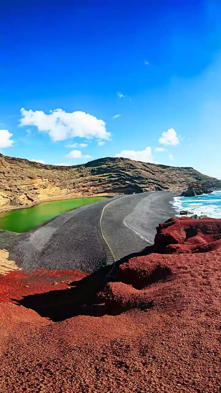 From Black Volcanic Land To Neon-Green Lagoons: Inside A Unique Spanish Island Shaped By 100+ Eruptions