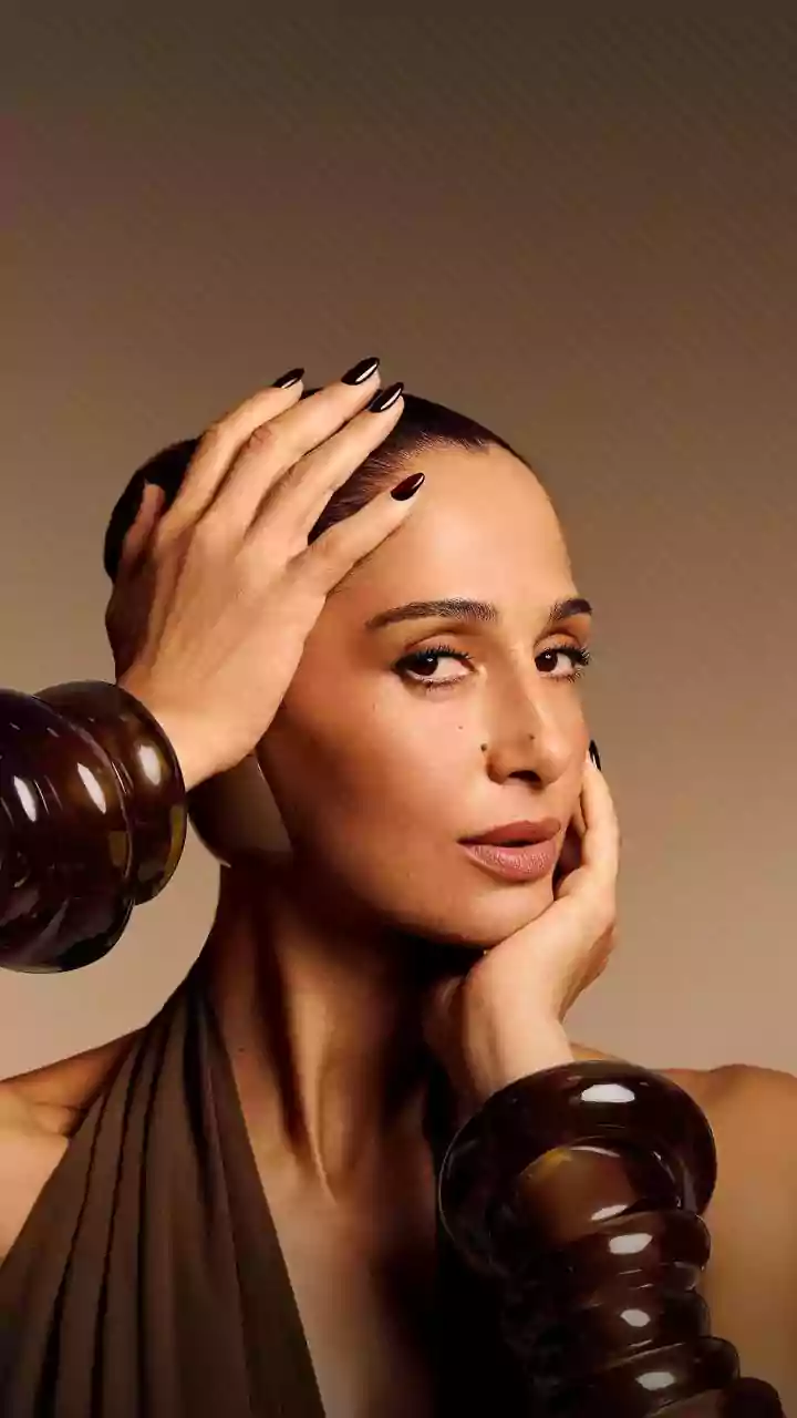 Sleek Ponytails and Top Knots Help Control Monsoon Frizz while Keeping Strands Back