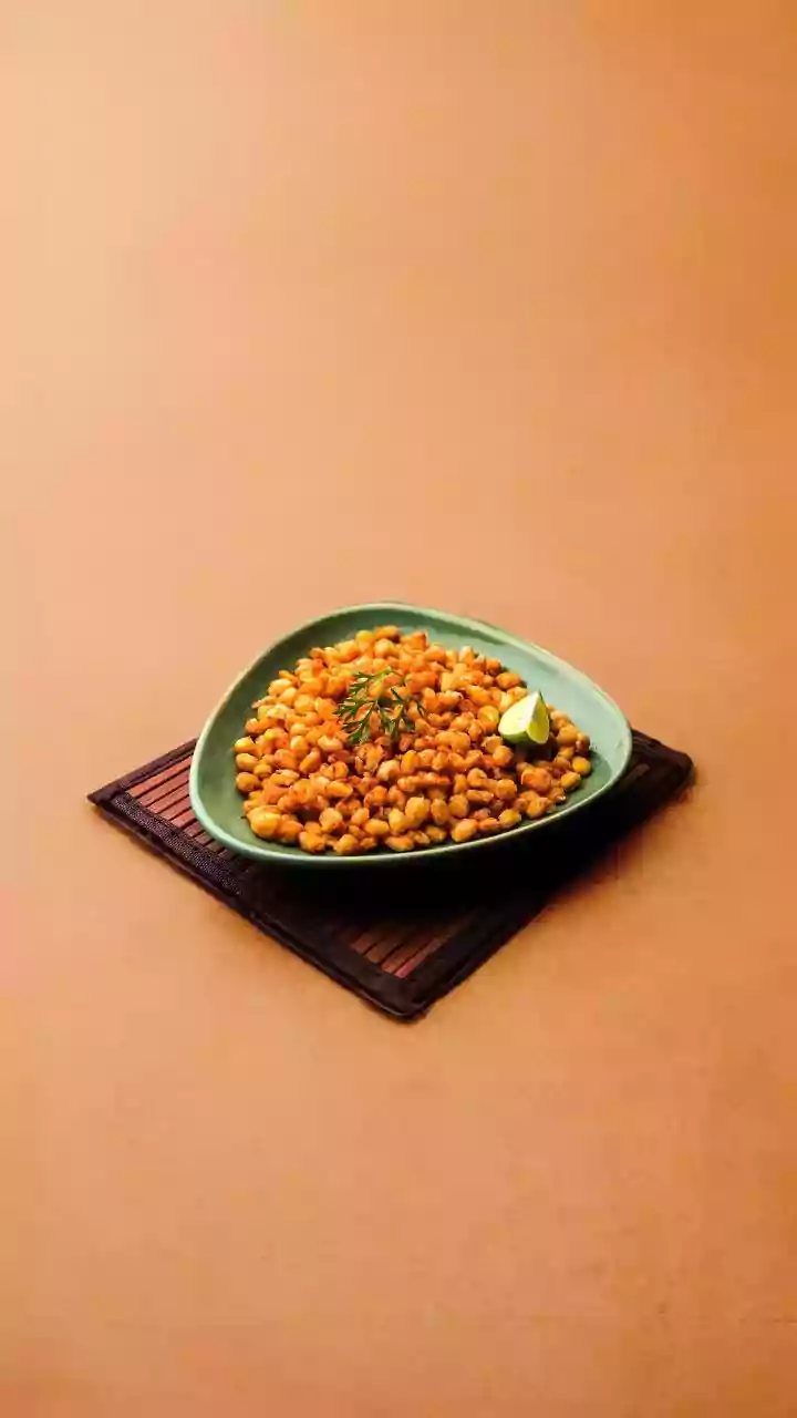 Why India's Roasted Corn Tradition Continues To Thrive Every Rainy Season