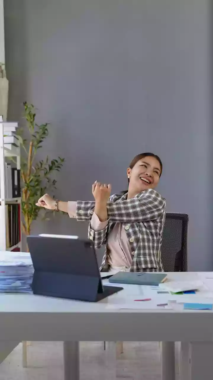 Say Goodbye to Back Pain With Afternoon Desk Yoga Stretches