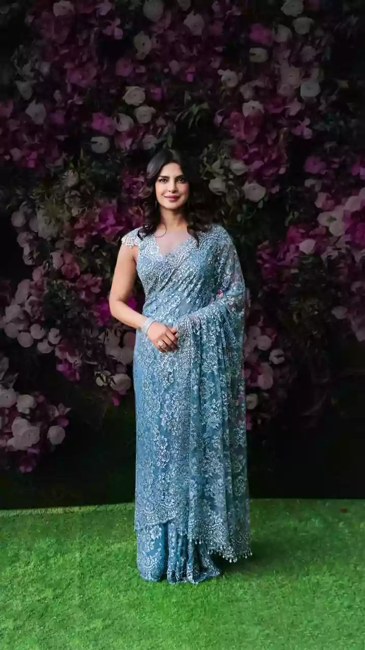 Priyanka Chopra's 'Desi Girl' Look: A Saree, Gun, and Rajamouli's Vision