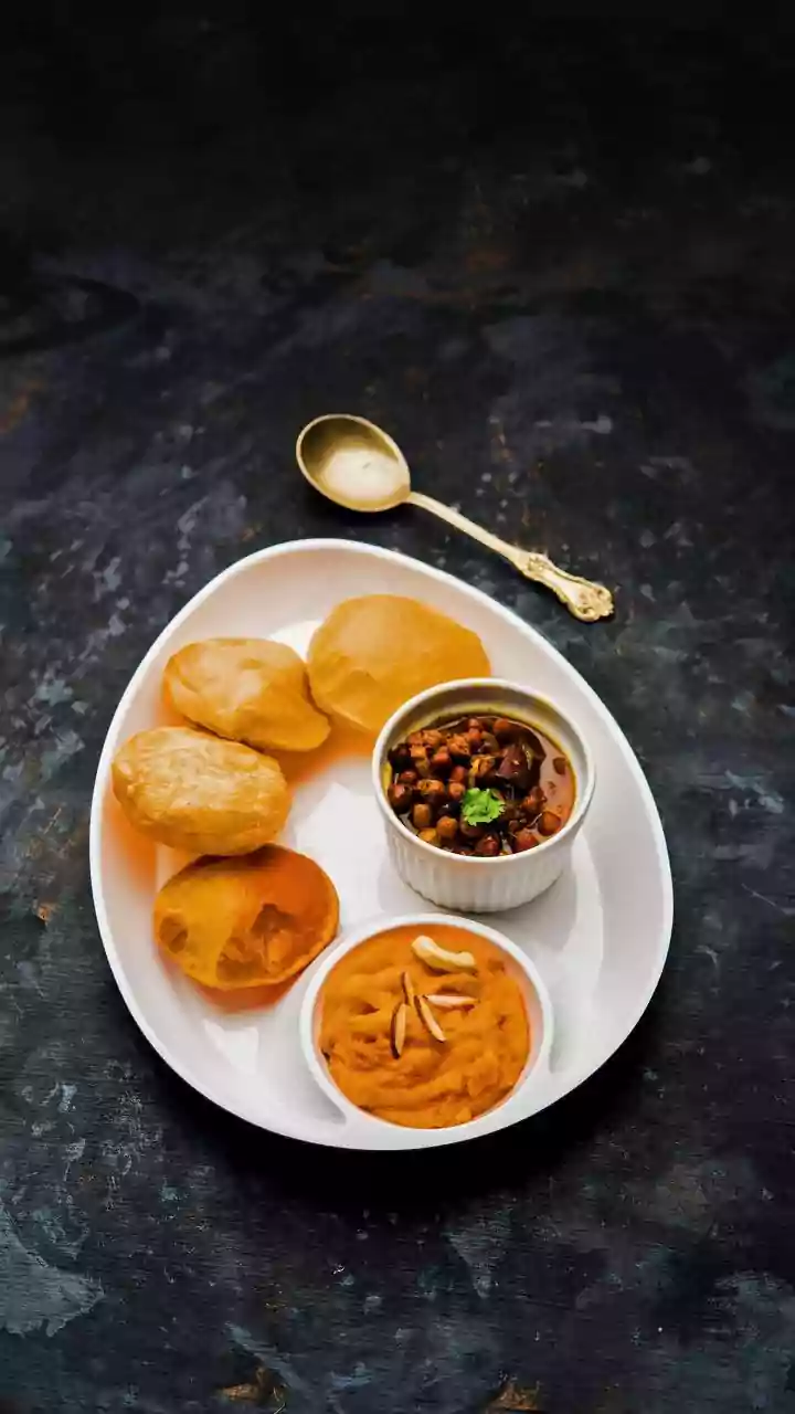 Unexpected Indian Feast Aloft: Passenger's Delight with Air India's Halwa Puri Channa on Bali Flight
