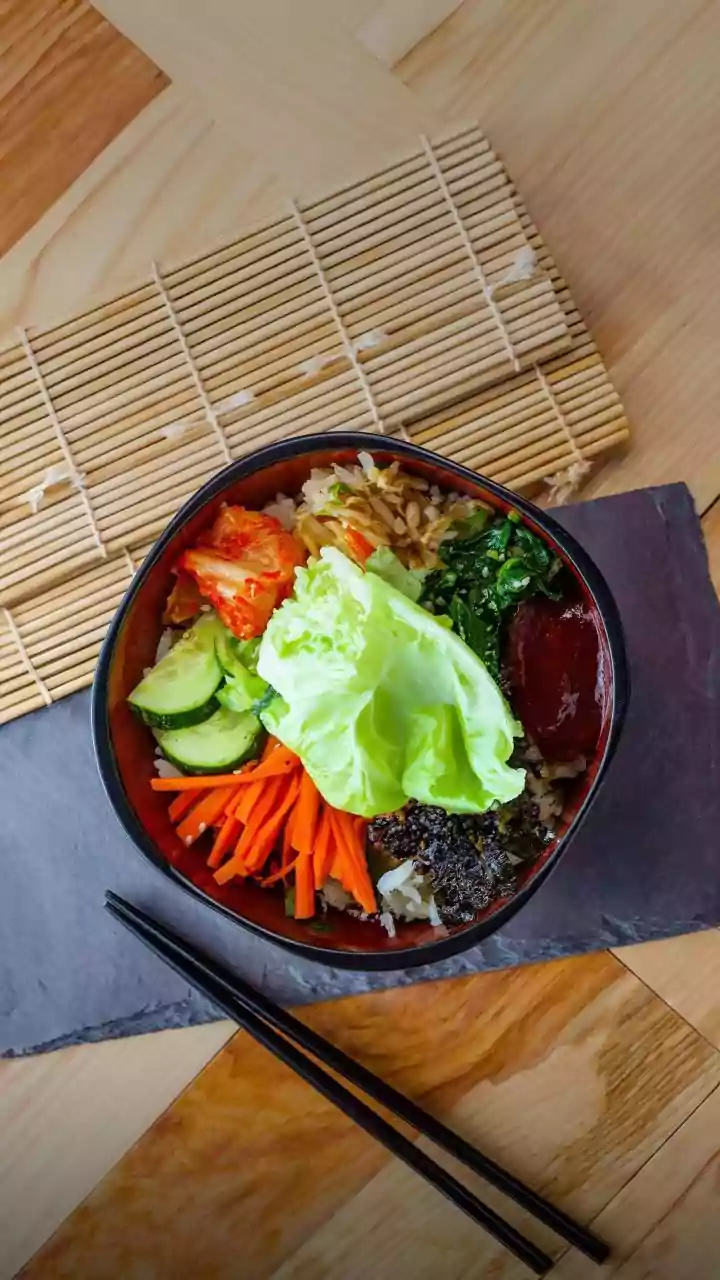 Gochujang gives tofu rice bowls fermented heat and sweetness, Crisping tofu separately helps preserve texture And The dish is Korean-inspired rathe...