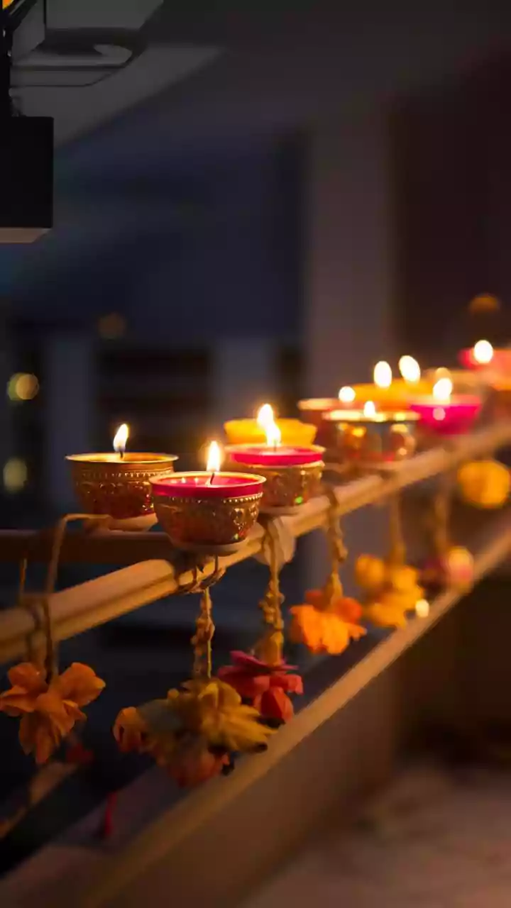 Simple Sustainable Hacks For Styling Balconies With Brass Lamps and Clay Diyas