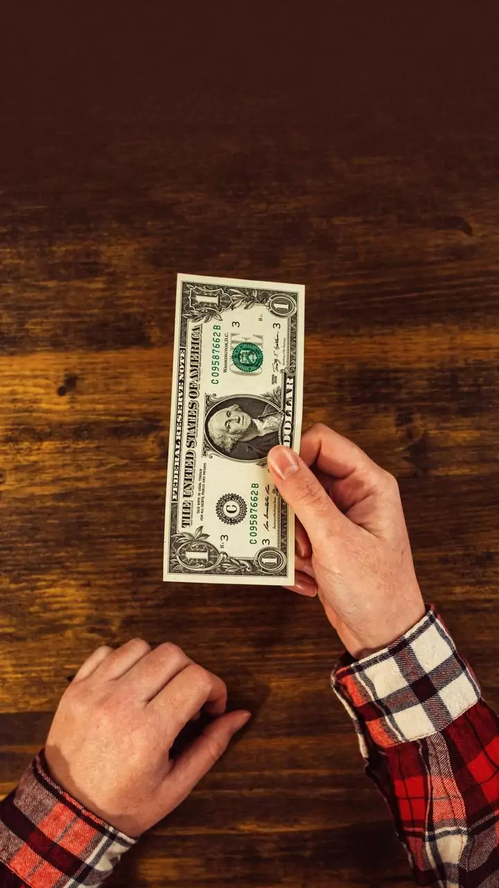 Rupee gains 42 paise against US dollar