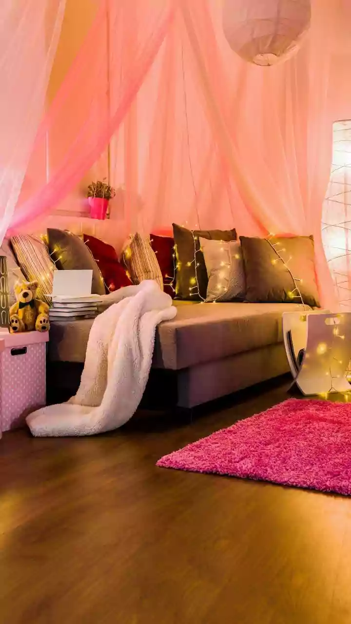 How Warm Fairy Lights and Sheer Curtains Can Instantly Upgrade A Small Apartment Lounge