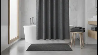 Even A Basic Bathroom Can Feel Intentional With Matching Textiles