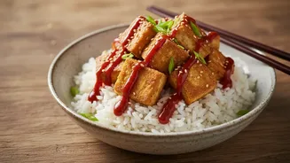 Crisping tofu separately helps preserve texture Gives Gochujang gives tofu rice bowls fermented heat and sweetness A Clearer Reader Angle