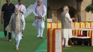 Narendra Modi pays tribute to Mahatma Gandhi at Raj Ghat