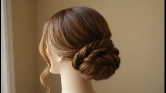 Face-Framing Strands Can Soften the Finished Low Bun around the Face