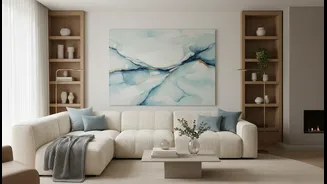 Cream Sofas Pair With Pale Blue Art for a Restful Living Space