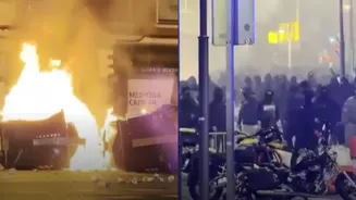 Spain riots: Cars,containers & police bike torched