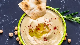 From Chickpeas To Tahini: How Extra Lemon Juice Elevates Homemade Hummus Dips