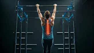 Gym Goers Trade Heavy Weights For Spinal Decompressing Dead Hangs