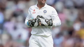 Why did Dhoni retire from Test cricket in 2014?