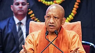 UP CM Yogi Adityanath Hands Over Land Allotment Letters To Investors In YEIDA Area