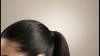 For a Sleek Finish, Smooth the Hairline before Securing the Ponytail