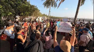 About 100 people at Carter Road protest 45,000 mangrove cuts
