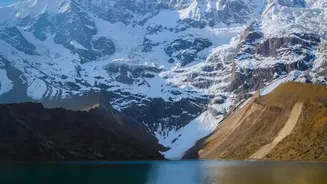 The Deo Tibba Base Camp Trek Ends beneath a Snow-Covered Himalayan Giant