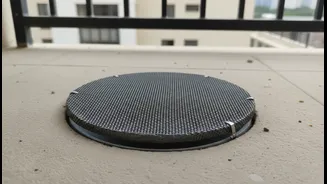 How to install affordable mesh screens in balcony drainage lines to block gnats