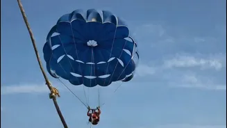 Video: Tourist falls into sea after parasailing cable snaps