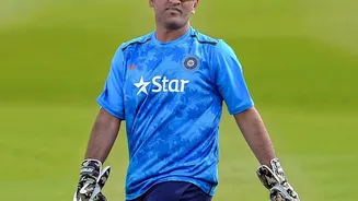 Why did Dhoni announce Test retirement in 2014?