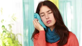 Fix ear discomfort with warm cloth packs