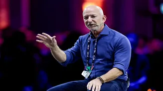 Jeff Bezos likens AI boom to the 1990s biotech bubble, says society will benefit anyway