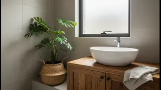 Use Natural Textures To Warm Up A Plain, Tiled Bathroom