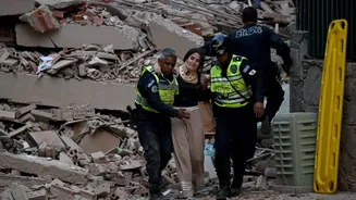 Caught on cam: Buildings sway, dust clouds rise in Caracas as twin quakes hit Venezuela