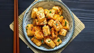 Gochujang gives tofu rice bowls fermented heat and sweetness, But The dish is Korean-inspired rather than a claim of strict authenticity