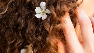 Why Floral Barrettes Work Double Duty By Taming Bangs And Adding Spring Charm