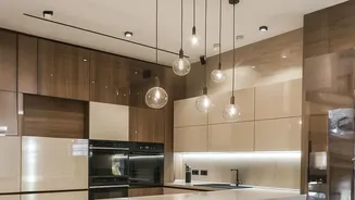 Bold cabinets meet neutrals in kitchens