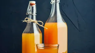 Easy flavor infusions for homemade kombucha using ginger, fruit juices, and SCOBY tea