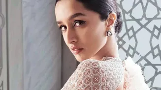 Sleek Ponytails and Top Knots Help Control Monsoon Frizz