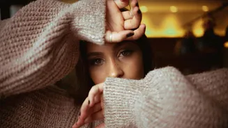 Score a stylish winter look with ruched sleeve sweaters