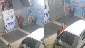 WATCH: Thief Wearing PM Modi Mask Attempts To Steal Phones From Rajasthan Shop