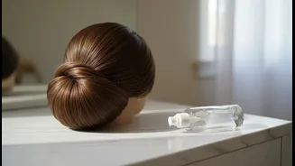 Use Smoothing Serum Sparingly So the Low Bun Keeps Its Volume
