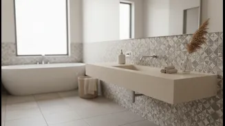 A Quiet Colour Palette Can Make Busy Bathroom Surfaces Feel More Cohesive
