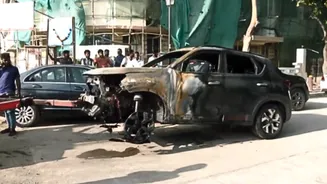 Car Catches Fire at Mumbai's Marine Drive, Traffic Disrupted on Stretch - WATCH