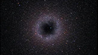 Decades Of Data Helped Expose A Black Hole Inside A Familiar Cluster
