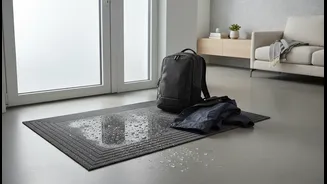 Why Compact Flats Require Dedicated Heavy-Duty Drip Zones for Tech Bags and Wet Outerwear