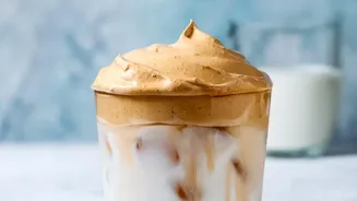 Biscoff Iced Latte Mixes Caramelised Spread With Coffee And Cold Milk, Warming Biscoff Into Milk Helps The Spread Dissolve Smoothly And The Drink I...