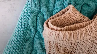 Stored Winter Clothing Should Be Folded When Heavy Knits Could Stretch